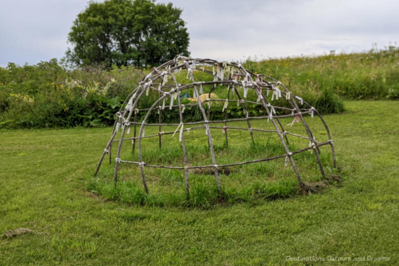 Dome shaped ceremonial sweat lodge made of twigs and branches