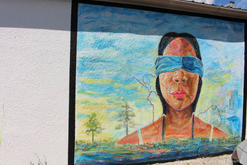 Mural showing a blindfolded woman 
