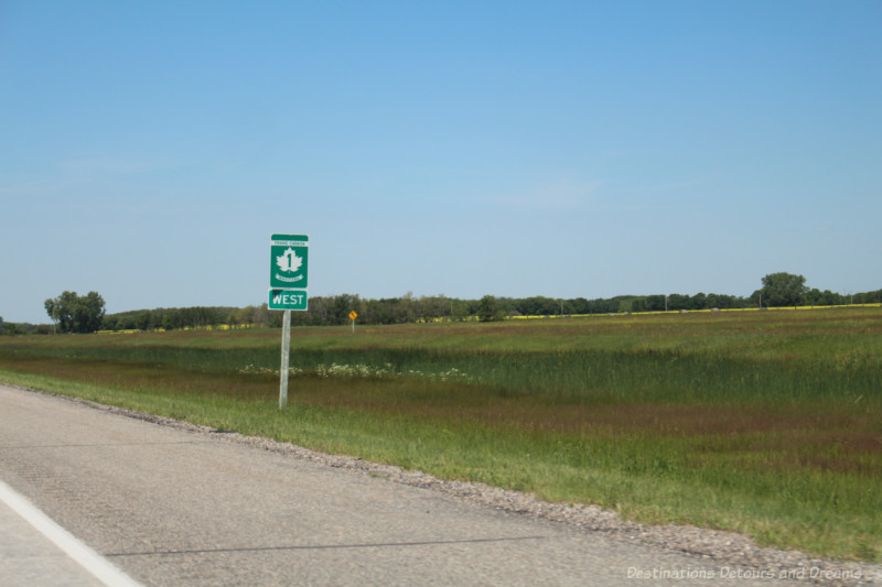 Signpost on the side of the road identifying Highway Number 1 West 