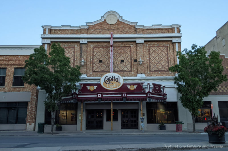 Historic theatre building, built in 1916, with ornamental brickwork, cornice, and parapet