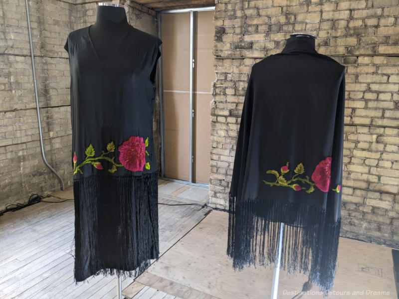 Black flapper dress with embroidered flower at waist and matching jacket