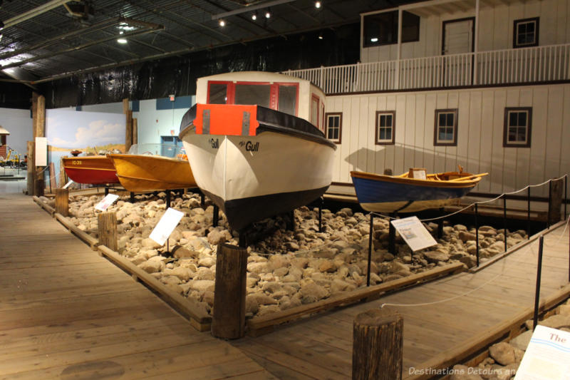 Several boats on display in a museum