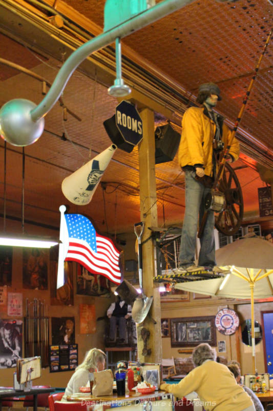 Eclectic mix of vintage decorations on wall and ceiling of Lute's Casino in Yuma