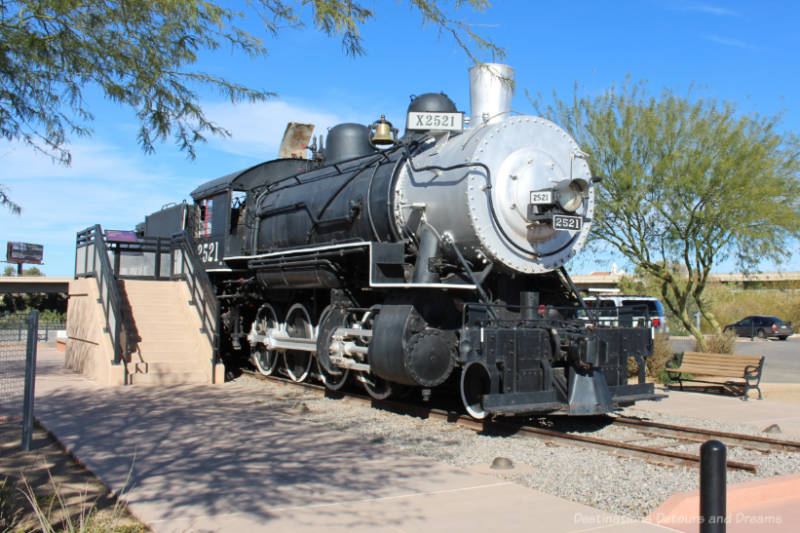 Restored 1907 Baldwin steam locomotive on display in a public plaza in Yuma