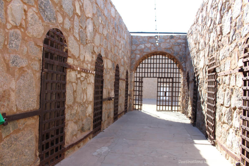 Yuma Territorial Prison Park Prison cell block with stone walls and steel doors