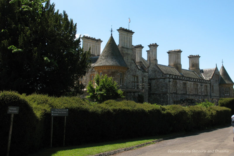 Gothic-style palace house surrounded by hedges