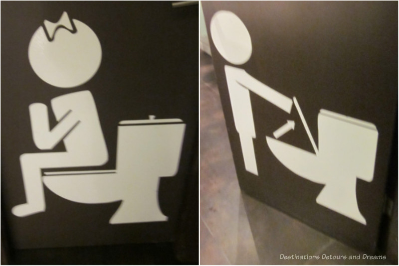 Toilet Door Signage Side-by-side view of two toilet doors figures, one showing a figure with a bow in hair sitting on toilet, one showing a figure standing in front of toilet with lid up