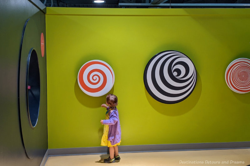 Manitoba Childrens Museum Spirals Toddler spinning spirals at a children's museum