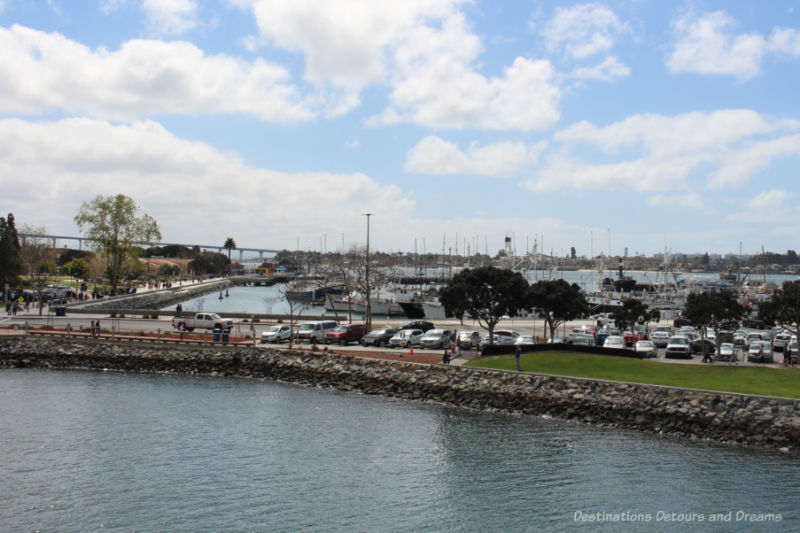 Waterfront walkway and boats in marina in San Diego Bay