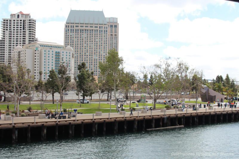 Waterfront walkway in San Diego with downtown buildings in background