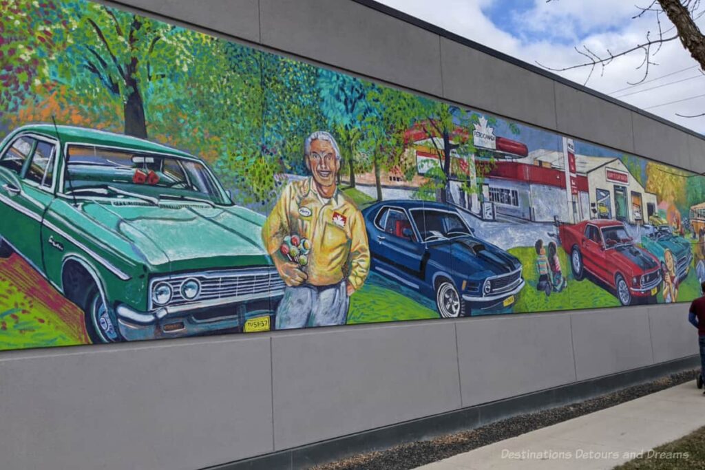 A mural featuring old cars and a Petro-Canada gas station.