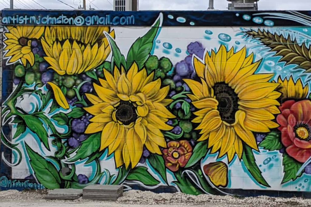 Bright yellow sunflowers on part of a Ukrainian-themed murals