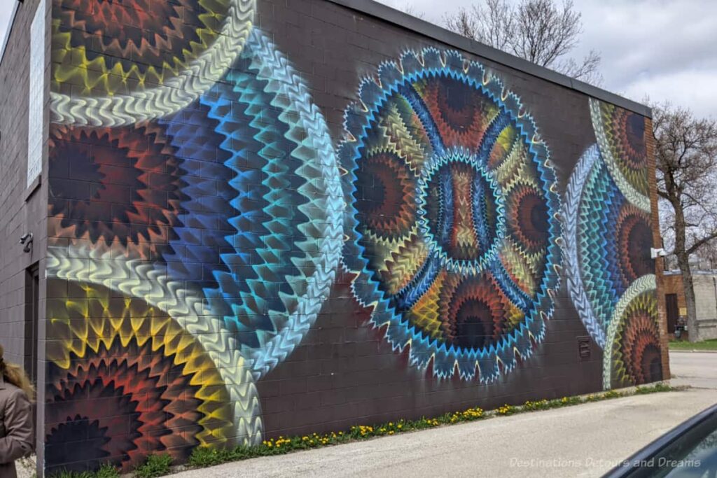 Colorful murals of circles and geometrics designs much like those made by a Spirograph speak to the theme of time