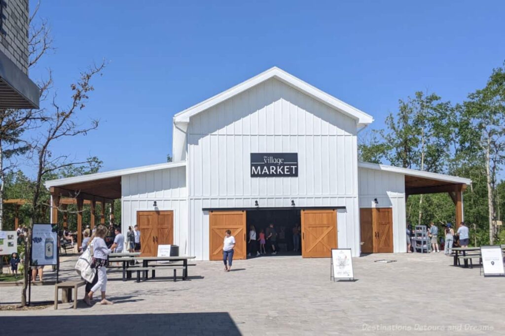 White barn-like building housing a farmers and craft market 