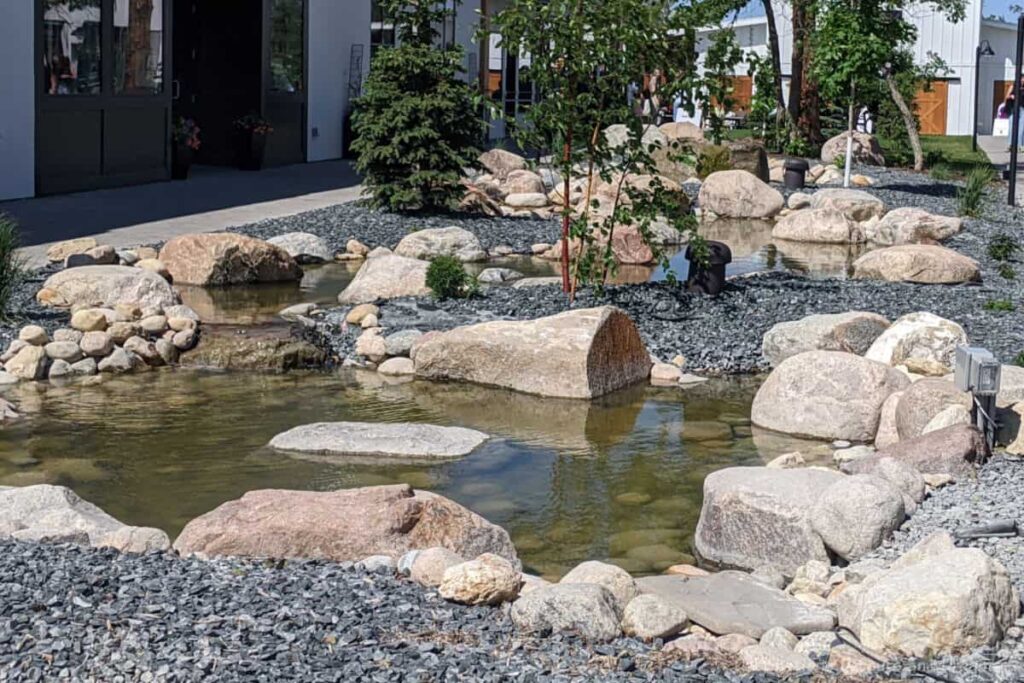 Stream over decorative rocks on a pedestrian boulevard in an outdoor shopping mall