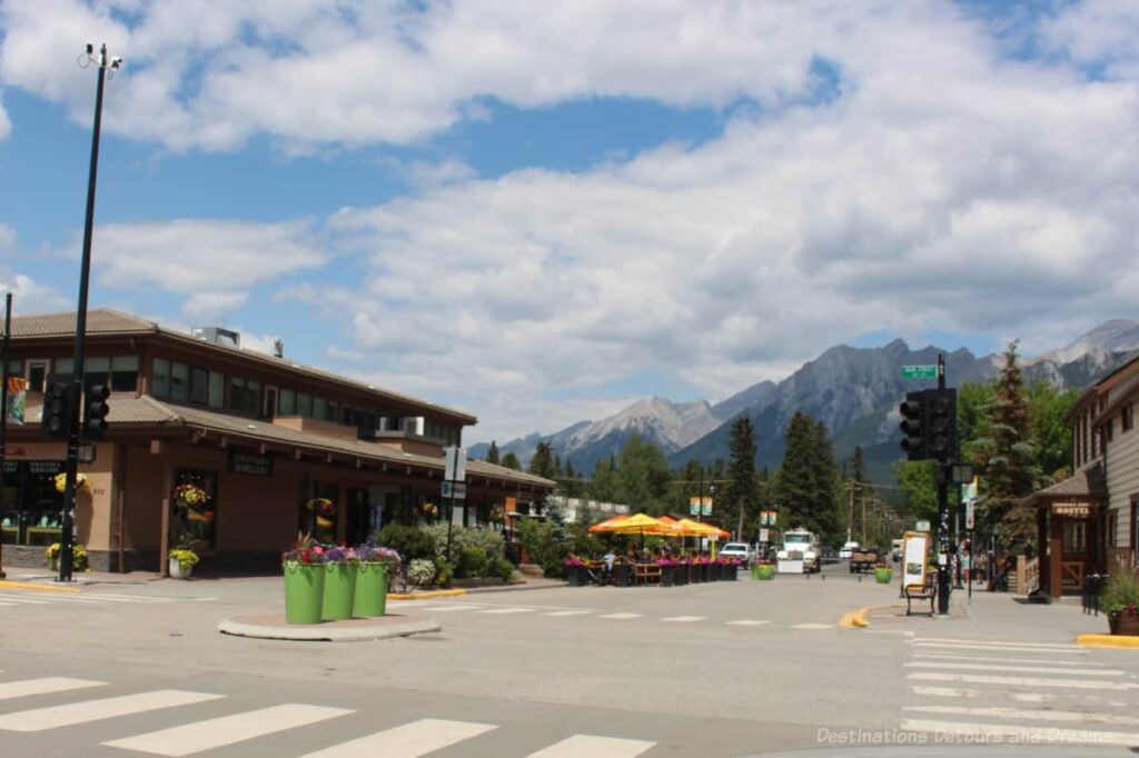 Pedestrian main street of Canmore, Alberta with view of mountains in the background