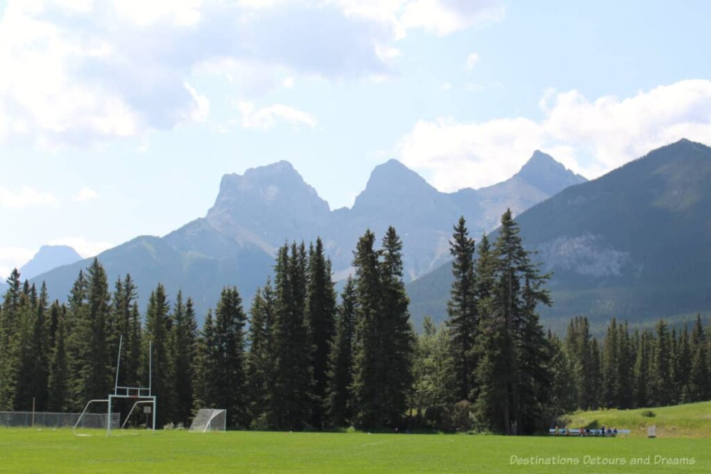 View from park in Canmore of Three Sisters peaks