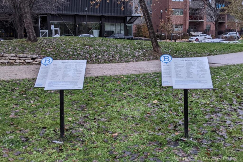 Two placards in a Winnipeg park contain literature excerpts as part of Project Bookmark Canada