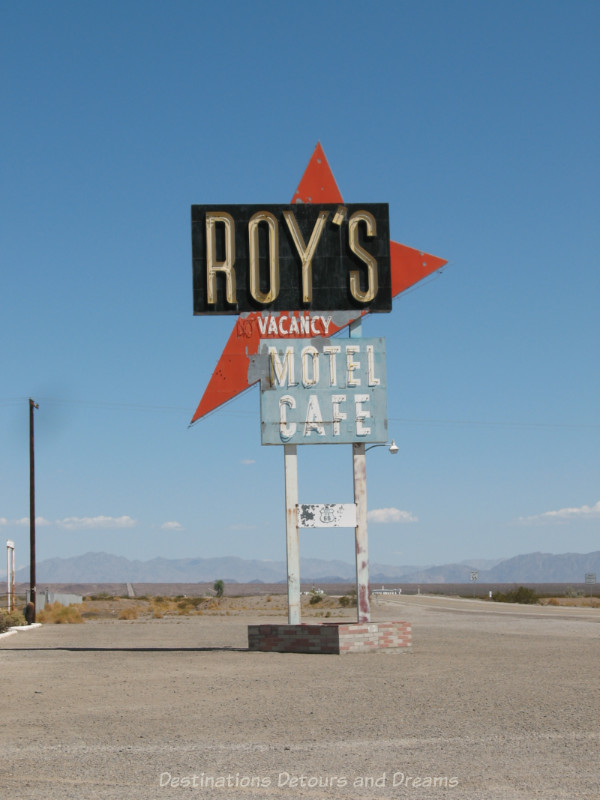 Faded old neon sign of motel and café along Route 66