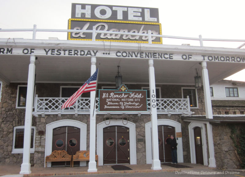 Stone front of vintage hotel with white columns and white trim