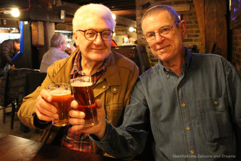 Two men with beer in an English pub
