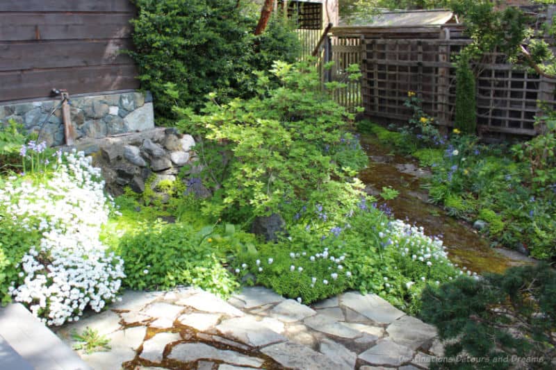 Helen Stewart Garden Secluded Corner A secluded corner of the garden with stone steps leading into it and a trellis fence at back