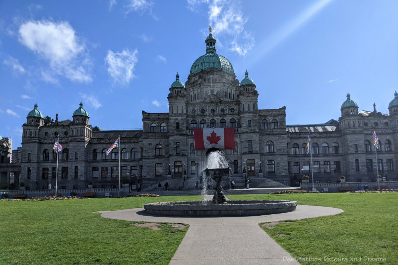 Legislative building featuring stone construction and domed roof areas