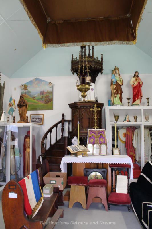 Pulpit and other religious artifacts displayed in a museum