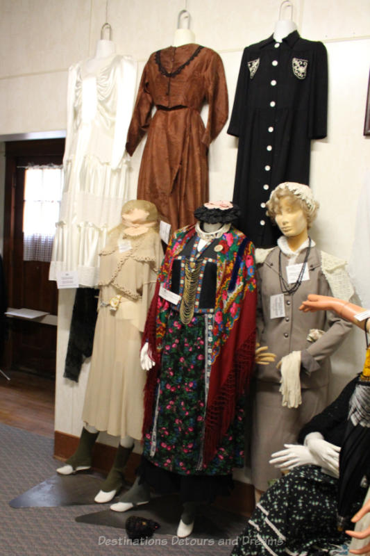 Collection of old clothing displayed on mannequins