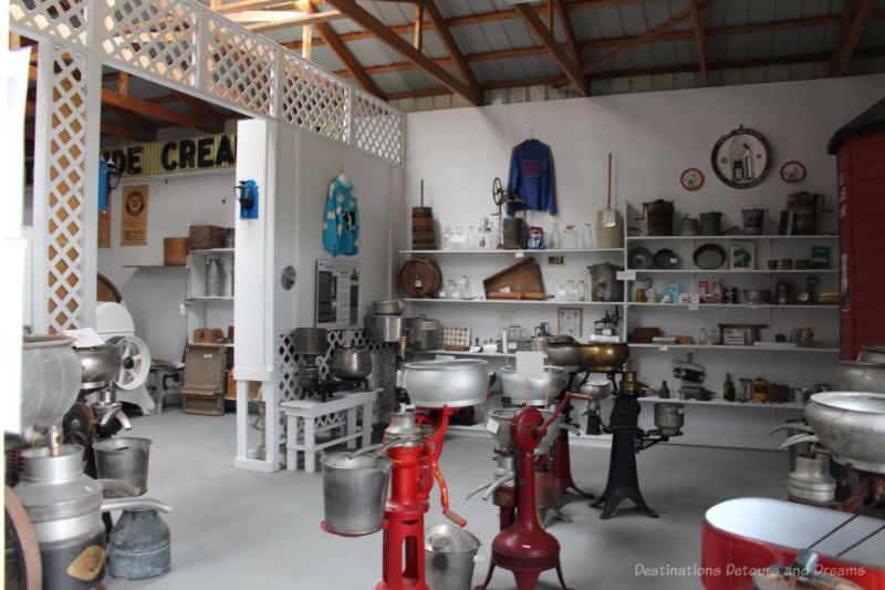 Display of cream separators and other dairy industry artifacts inside a museum