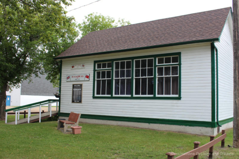 One room school house painted white with green trim