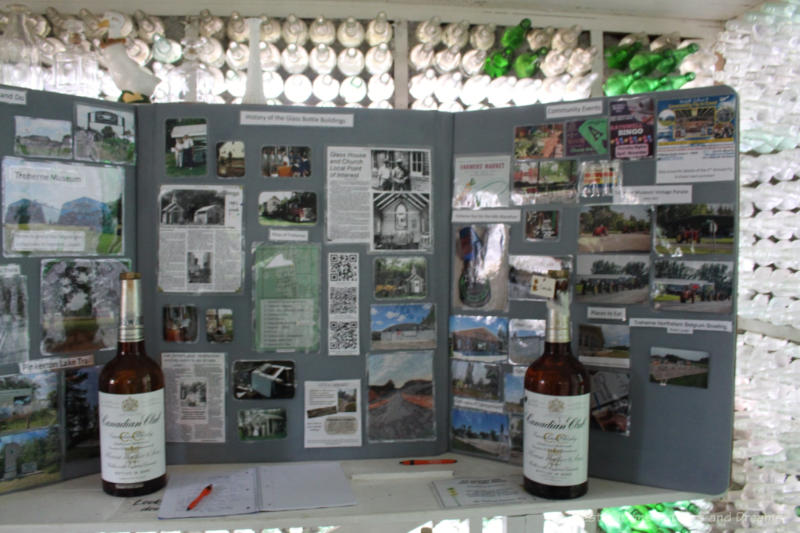A display board containing photos and newspaper articles