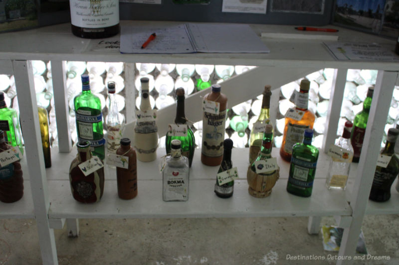 A collection of different coloured and shaped bottles