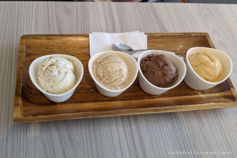 Winnipeg Food Chaeban Ice cream sampler - Four small bowls of ice cream on a wooden tray