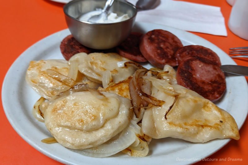 Winnipeg Food Kubasa Plate of fried perogies with onions and kubasa