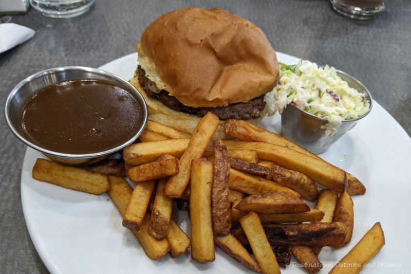 Winnipeg Savoury Foods The Nip Food plate containing hamburger, coleslaw, fries, and gravy