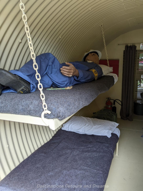 Miami Railway Station Museum Bunker Cots Bunk bed cots set up in metal underground bunker with mannequin sleeping in upper bunk