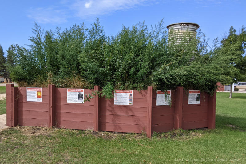 Miami Railway Station Museum Bunker Wood fencing surrounds a restored bunker with plantings on the roof