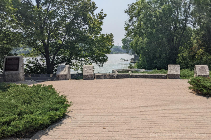 The Forks Turtle Tours National Historic Site Brick plaza overlooking river containing stone markers with historical information