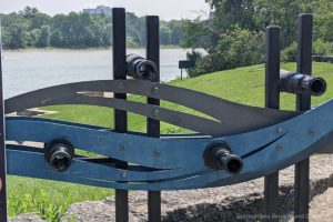 Blue structure with eye glass viewing onto river