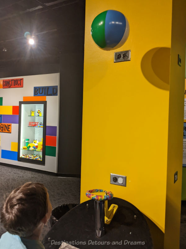 Floating beach ball exhibit in a science museum