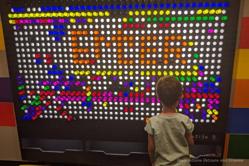 Backlit LiteZilla wall installation with different coloured rods to form patterns