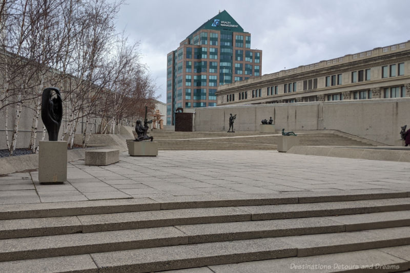 Rooftop patio featuring a number of sculptures