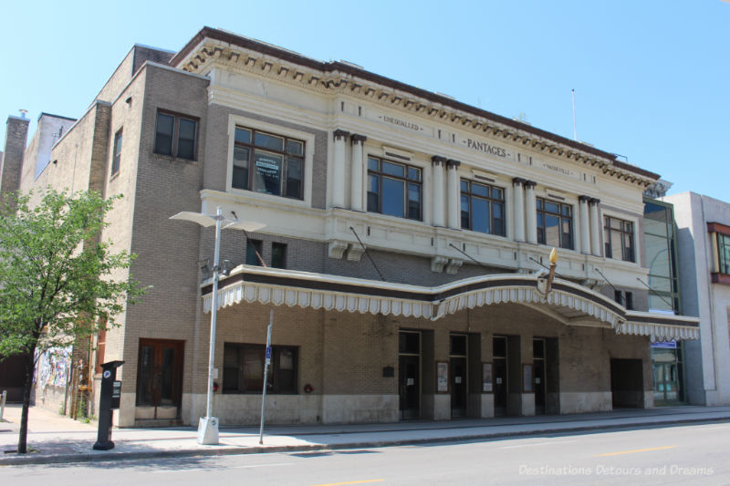 Winnipeg Pantages Theatre Front of a early 20th-century theatre with a canopy elegantly decorated with tan brick and cream-coloured terra cotta