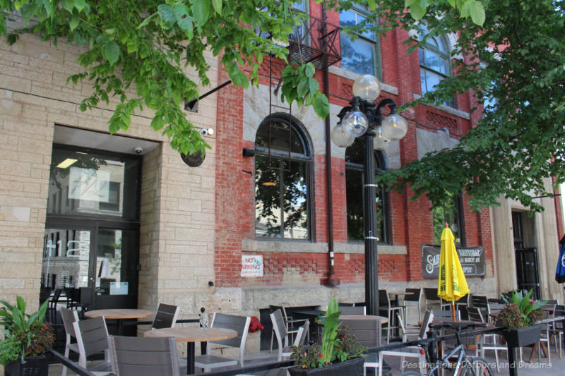 Winnipeg Exchange District Patio Sidewalk restaurant patio in front of red brick building