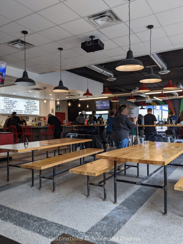 Devil May Care Taproom Taproom with long wood-topped tables