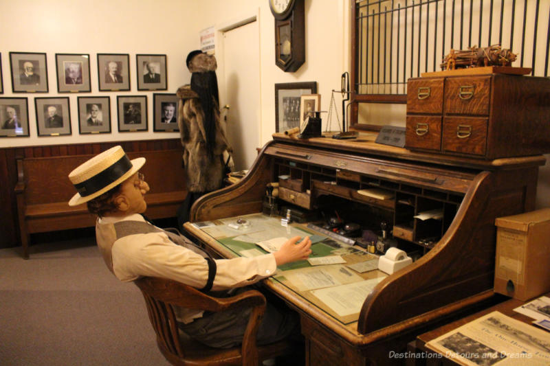 Sipiweske Museum Wawanesa Insurance Museum display showing early twentieth century accountant at a rolltop desk