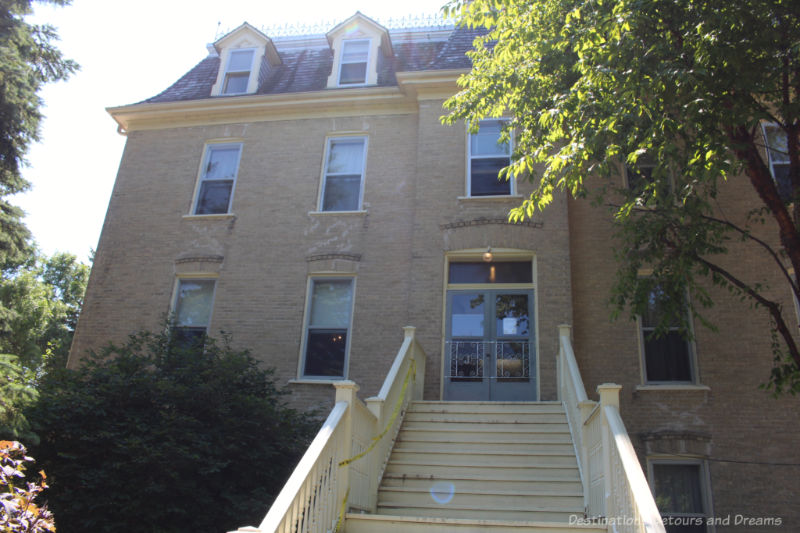 Three story brick building with long set of stairs leading up to up - former convent now a museums