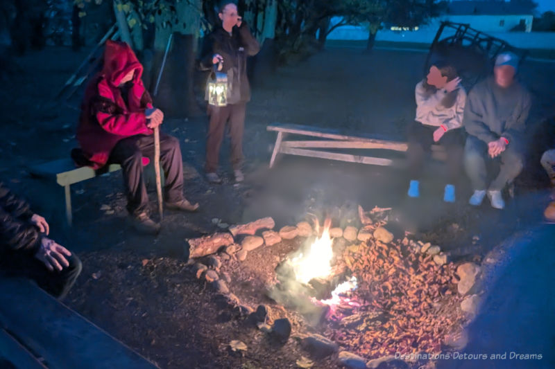 People sitting around a campfire